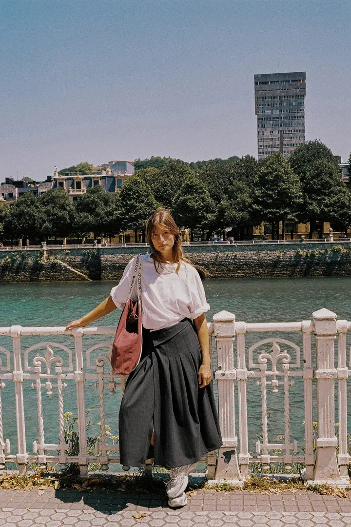 PLEATED CROSSOVER SKIRT