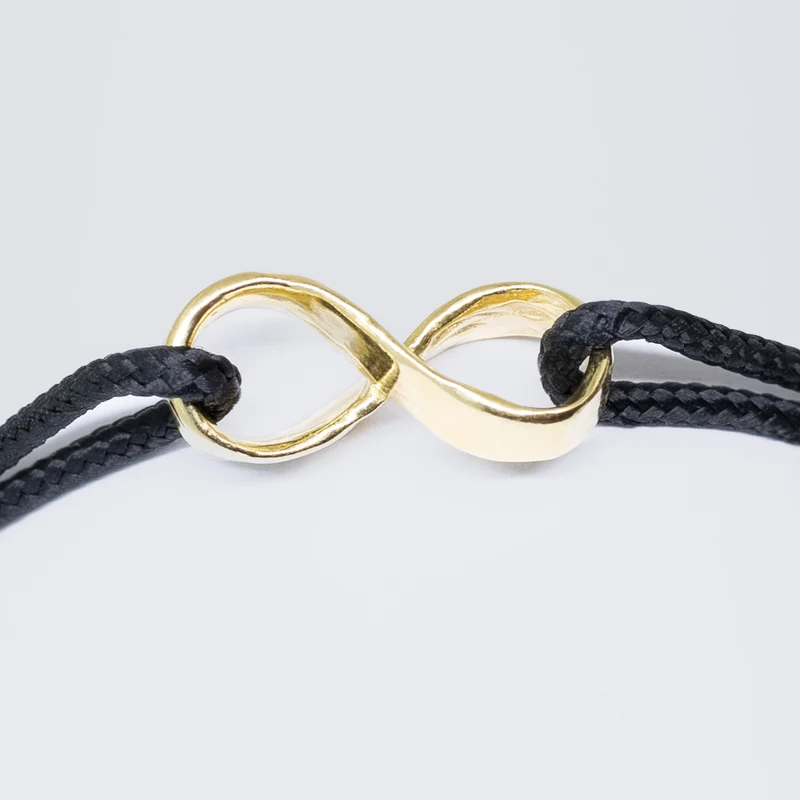 Infinity armband - verguld goud - zwart