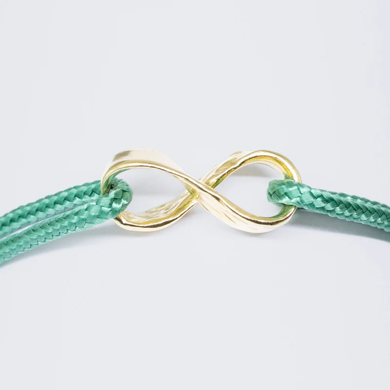 Infinity armband - verguld goud - groen
